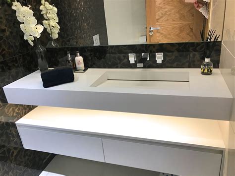 This custom fabricated integrated vanity top and sink offers an easy design solution to reflect your unique bathroom style. Surrey bathroom Corian vanity and wooden unit | unique
