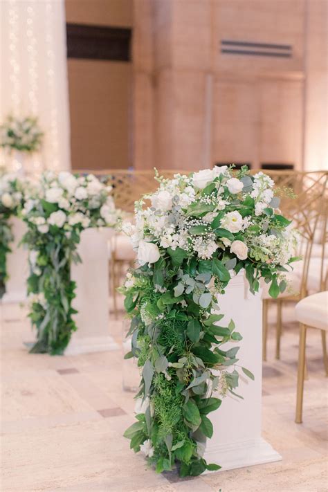 Cascading Greenery And White Flower Aisle Arrangements Wedding Aisle