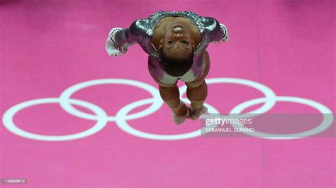 Us Gymnast Gabrielle Douglas Performs During The Womens Uneven Bars