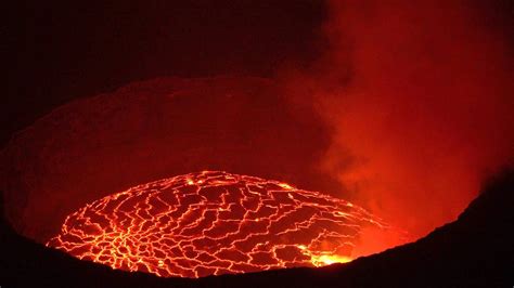 Mount nyiragongo is an active stratovolcano with an elevation of 3,470 m (11,385 ft) in the virunga mountains associated with the albertine rift.it is located inside virunga national park, in the democratic republic of the congo, about 20 km (12 mi) north of the town of goma and lake kivu and just west of the border with rwanda.the main crater is about two kilometres (1 mi) wide and usually. Nyiragongo Volcano, Virunga NP, DR Congo in 4K Ultra HD ...