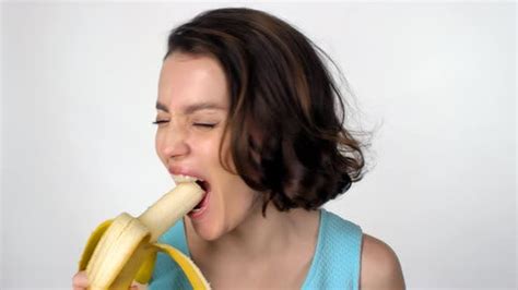 happy woman eating banana stock footage videohive