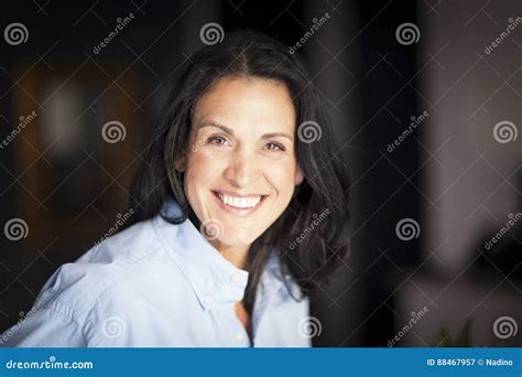 Mature Spanish Businesswoman Smiling At The Camera At The Office Stock