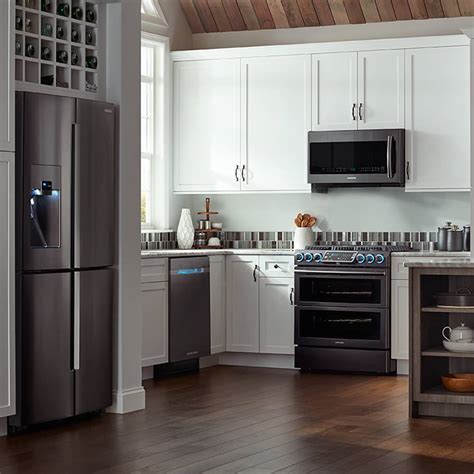 A traditional kitchen furnished with a kitchen island in the middle, made in a rectangular shape with a rounded front. 12 Gorgeous Slate Appliances with White Cabinets Ideas for ...