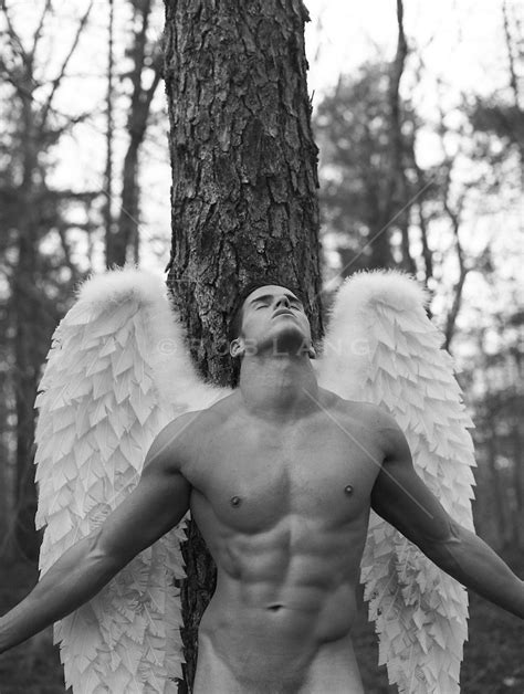 Naked Man With Angel Wings By A Tree ROB LANG IMAGES LICENSING AND