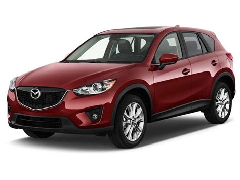 A Red Mazda Cx 5 Parked In Front Of A White Background