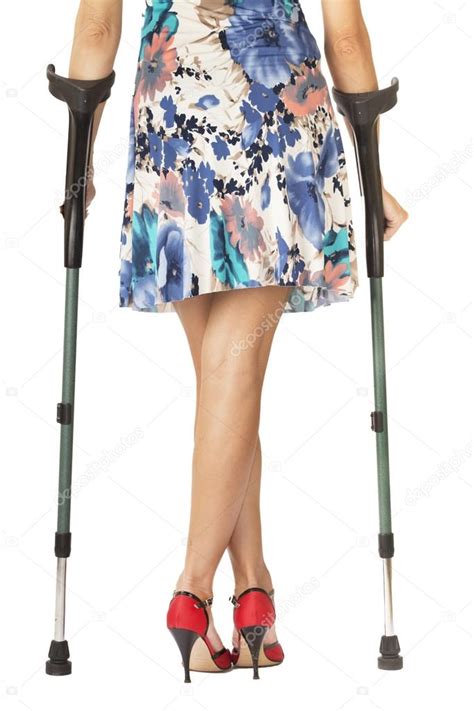 Woman With Red High Shoes On Crutches — Stock Photo © Tonymiro98 81629970