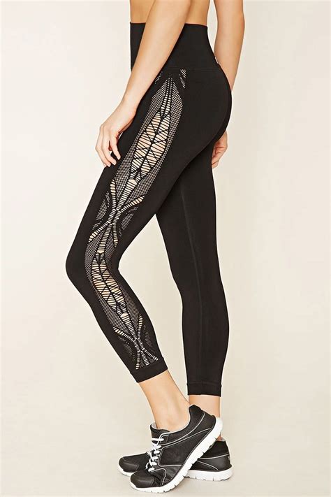 A Pair Of Athletic Leggings Featuring A Lasercut Design At Each Side Moisture Management And A