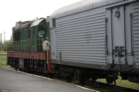 mh17 train carrying bodies of 282 crash victims sets off to morgue daily mail online