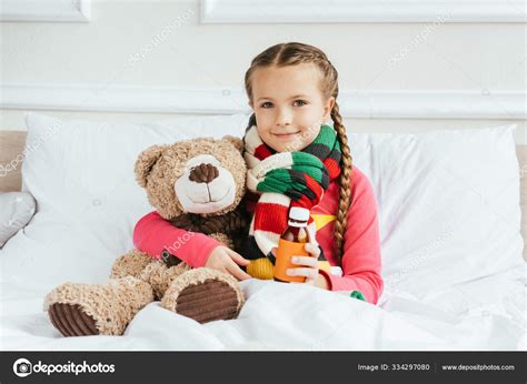 Smiling Sick Child Scarf Holding Syrup Sitting Bed Teddy Bear — Stock