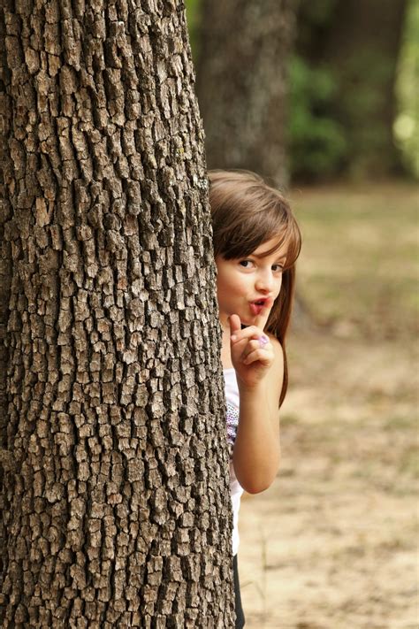 Little Girl Hiding Behind Tree Free Stock Photo Public Domain Pictures