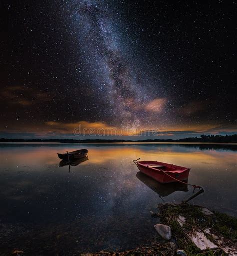 Surreal Lake With Boats Under Starry Sky Stock Photo Image Of