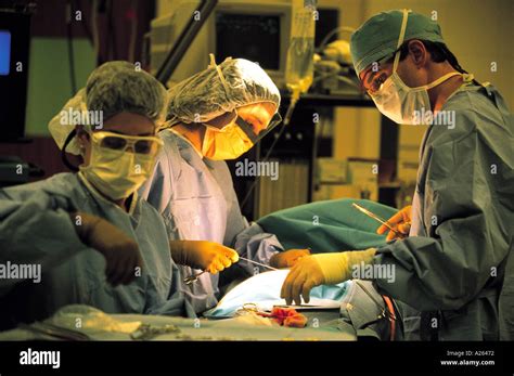Three Surgeons Performing A Hernia Operation On A Child Stock Photo Alamy
