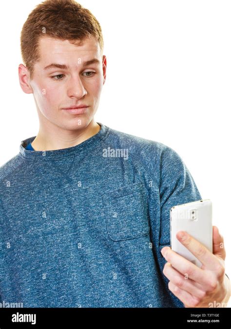 Teen Boy Texting On The Mobile Phone Young Man Reading Sms On