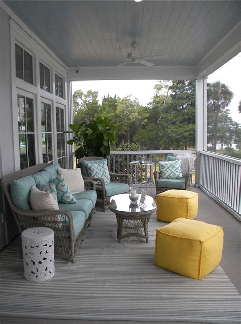 A Calming Beach House Style Front Porch Decorated In Blues And Grays