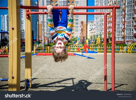 Happy Child Boy Hanging Upside Down Stock Photo Edit Now 1409040659