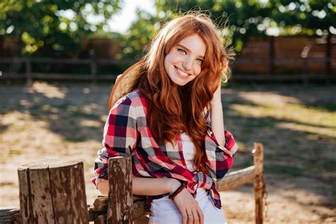 Happy Cute Young Woman Cowgirl Standing And Smiling On Farm Royalty