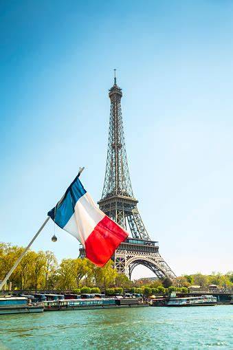 Eiffel Tower And French Flag In Paris France Stock Photo Download