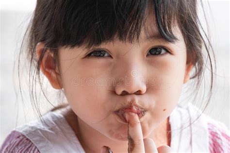 Cute Little Asian Girl Eat Chocolate Stock Image Image Of Bite Black 158248909