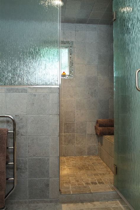 The Large Walk In Shower Features Rain Glass For Privacy And Gray Tile That Continues