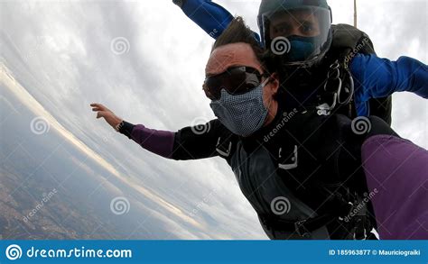 Skydiving Tandem With Protective Mask After The Lockdown Stock Image