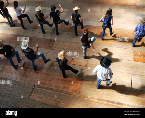 A Top View Of A Group Of Traditional Western Folk Dancing Under The