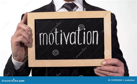 Motivation Written On Blackboard In Businessman Hands Self Improvement