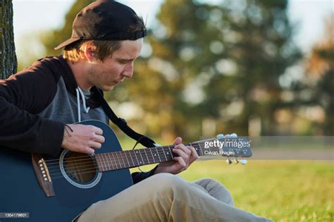 Young Musician Outside Playing Guitar High Res Stock Photo Getty Images
