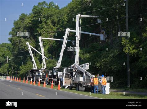 Line Up Of Bucket Trucks For Trimming Trees Along Highway North Florida