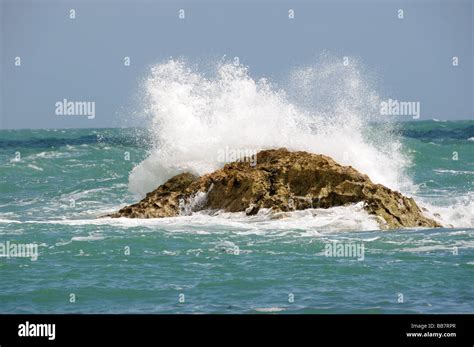Wave Breaking On Rock Stock Photo Alamy