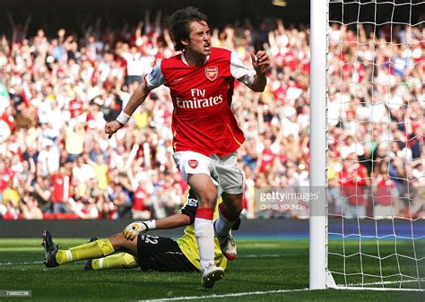 arsenal s czech international midfielder tomas rosicky puts the news photo getty images