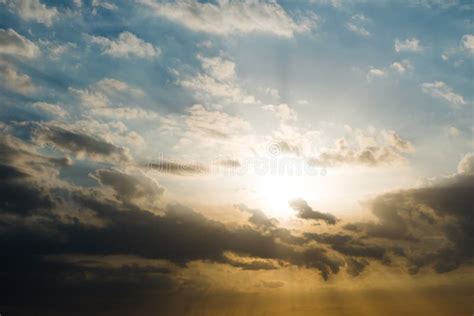 Beautiful Sunset Over The Sea With Sunbeam Through Clouds Stock Photo