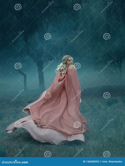 Fairy Tale Witch With Blond Hair Who Runs In A Dark And Dense