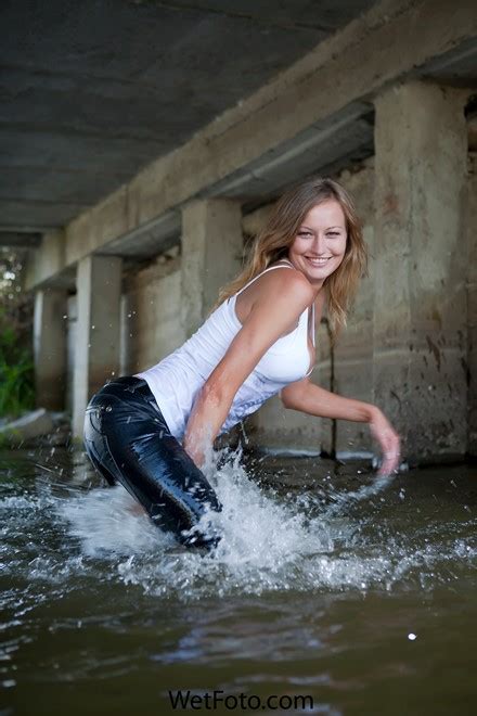 Hot Blonde Girl In Tight Jeans T Shirt And Shoes Get Soaking Wet In Lake Wetfoto