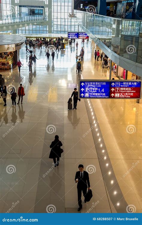 Passengers Walking In Hong Kong Chek Lap Kok Airport Editorial