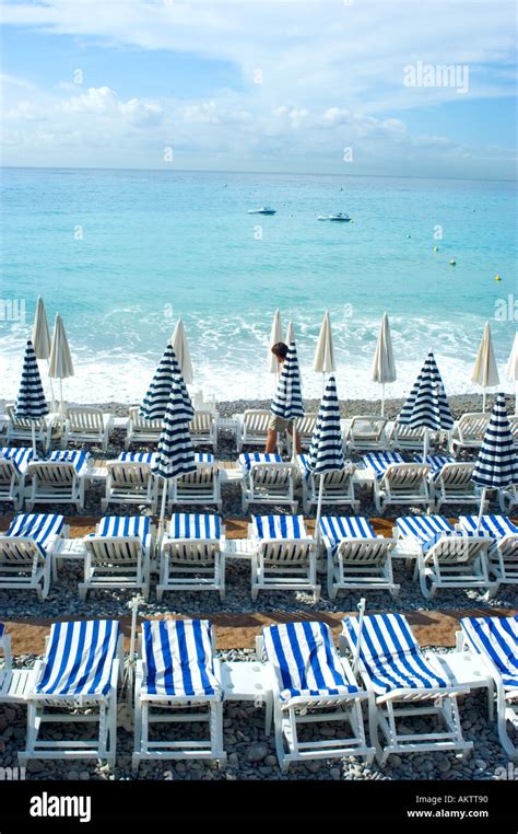Nice France Beach Scene With Beach Chairs And Striped Beach Stock