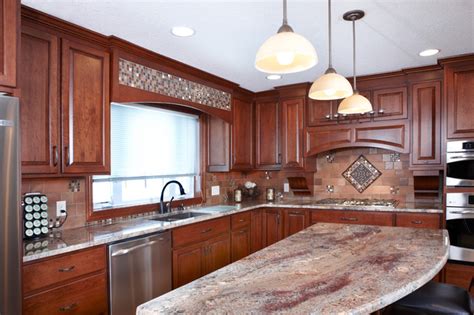 Stunning kitchen designed with cherry cabinets and crema bordeaux granite countertop. Custom cherry cabinets / Juparana Bordeaux granite