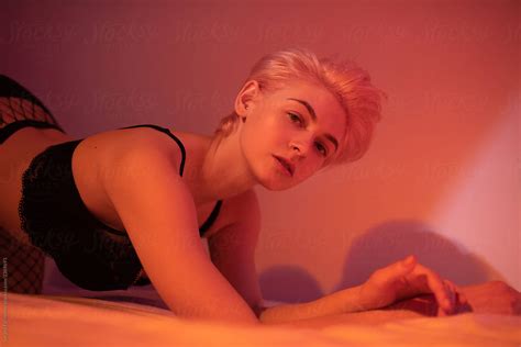 Sensual Woman Lying On Bed Near Wall By Stocksy Contributor Sergey Filimonov Stocksy