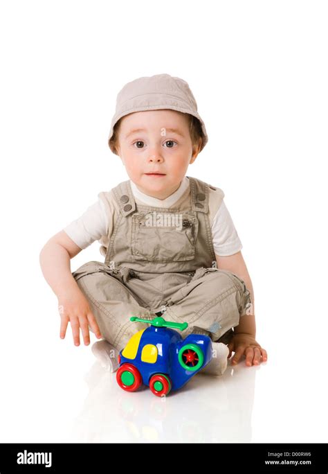 Baby Boy Playing With Colorful Car Toy Isolated On White Stock Photo