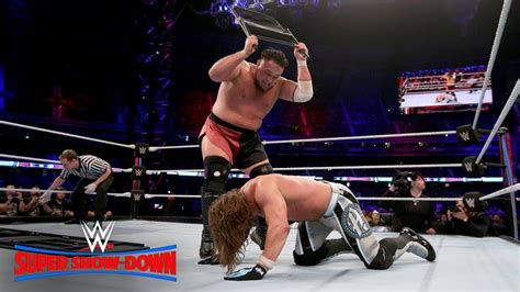 Samoa Joe Smashes Aj Styles Through A Steel Chair Wwe Super Show Down