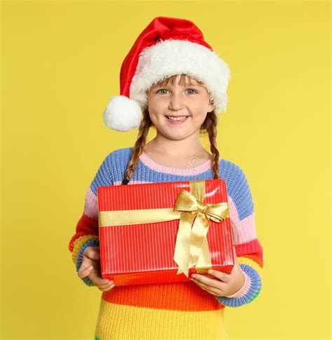 Cute Little Girl In Santa Hat With Christmas T Stock Image Image