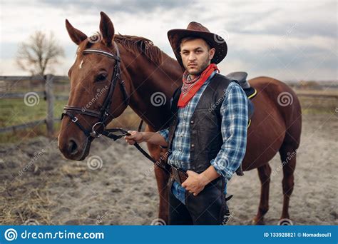 Cowboy Poses With Horse On Texas Ranch Wild West Royalty Free Stock