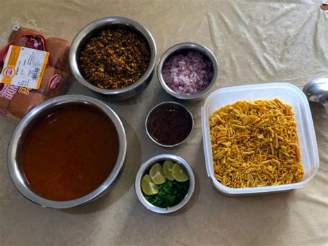 This video shows how to make popular maharashtrian spicy vegan curry called to assemble the misal: Misal Pav from Maharashtra | Simple Indian Recipes