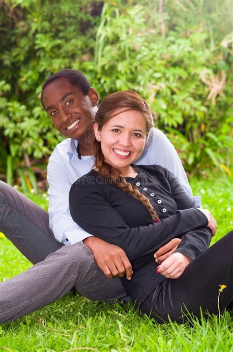 Beautiful Young Interracial Couple Sitting Garden Environment Embracing Smiling Happily To
