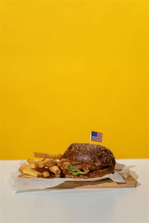 Burger And Fries With Sparkler · Free Stock Photo
