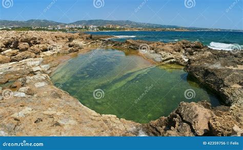 Natural Reservoir With Clear Water At Coral Bay Beach Stock Photo