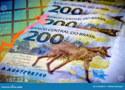 Banknotes Of Two Hundred Brazilian Reais Stock Exchange With Graphs