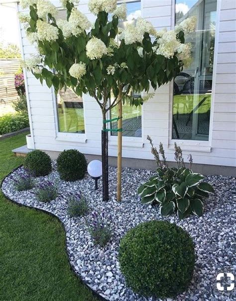 Use bundles of branches or sticks to create a garden post, then top with decorative stones or rocks from your garden. Grey and white mix rock | Front yard landscaping design ...