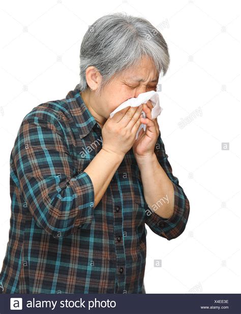 Mature Asian Woman Sneezing Stock Photos And Mature Asian Woman Sneezing