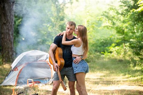 Romantic Couple On Camping Outdoor Adventure With Friends On Nature Hiking Couple In Love