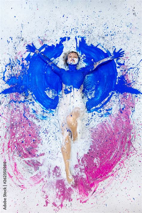Young Nude Artist Woman In Blue Pink White Paint Painted Lies On